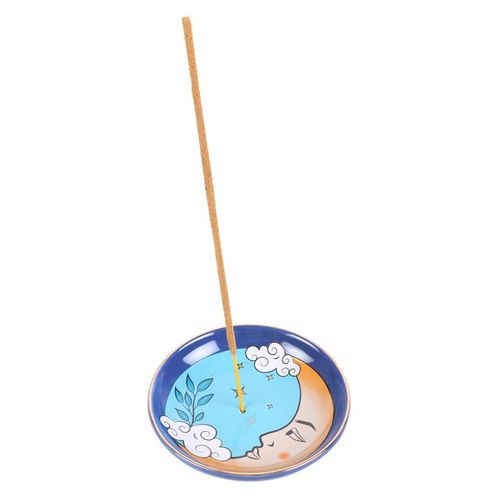 This contemporary incense holder showcases a captivating blue moon motif drawn from 'The Moon' tarot card. Crafted from ceramic, it offers an enchanting and functional space to burn incense sticks. Place your glowing incense in the center or use it to keep tiny treasures safe on your altar or nightstand.