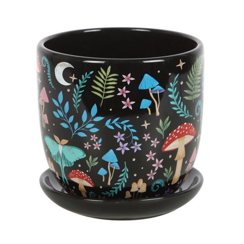 Black ceramic pot with colorful forest design on a white background