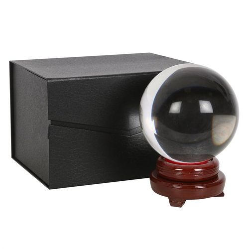 This enchanting crystal ball measures 15cm across and is accompanied by a delicate wooden stand and a charming display box. Its dimensions are 20cm tall, 15cm wide, and 15cm deep, while the packaging measures 17cm high, 26.5cm wide, and 19cm deep—perfect for your mystical rituals and sacred space.