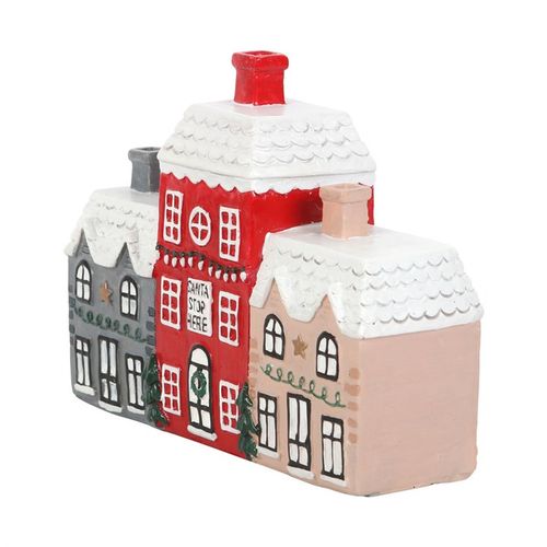 Decorative ceramic houses with snow on the roofs on a white background