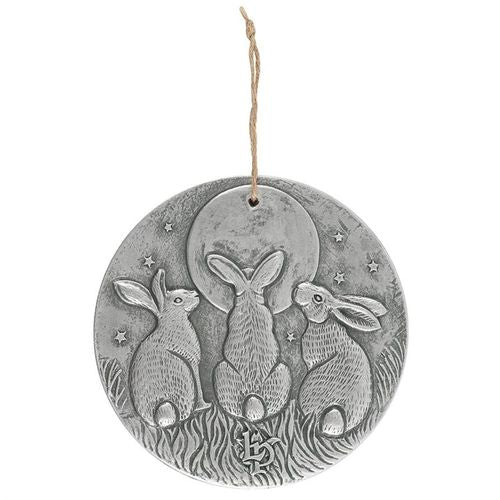 A stunning terracotta wall plaque with a silver-like effect and striking motif of three moon-gazing hares. This symbol is commonly used to represent fertilty and growth. Perfect for garden decor. Product Dimensions: H20cm x W20cm x D1.5cm Packaged Dimensions: H20.5cm x W20.5cm x D2cm