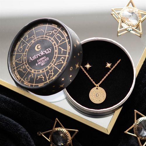 Jewelry set with necklace and earrings in an 'Astrology' themed box.