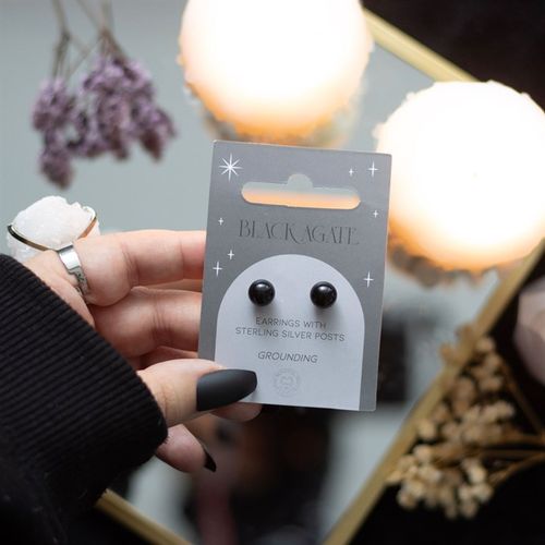 This pair of black agate crystal stud earrings comes on a matching backing card and makes a meaningful gift for those in need of spiritual protection. Black agate is a powerful semi-precious stone believed to create harmony and calm dark forces, making it ideal for grounding on protection.
