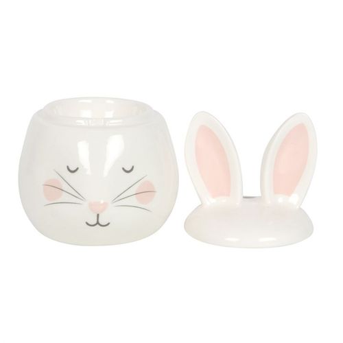 Ceramic rabbit-shaped container with a lid on a white background
