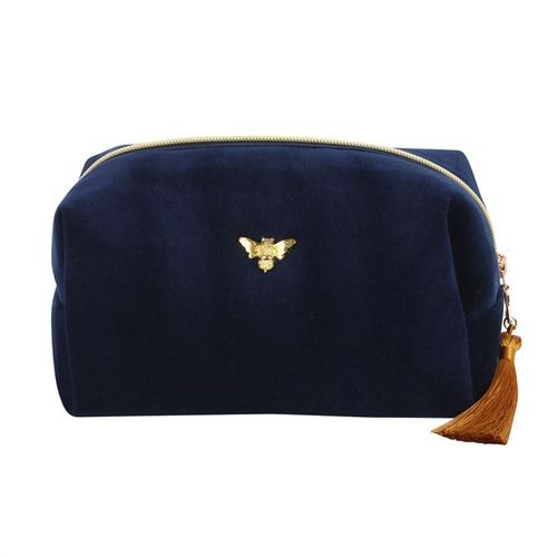 This elegant zippered bag is ideal for storing toiletries and features a gold tone bee accent and matching tassel. The stylish bag is ideal for the home bathroom and perfect for travel.