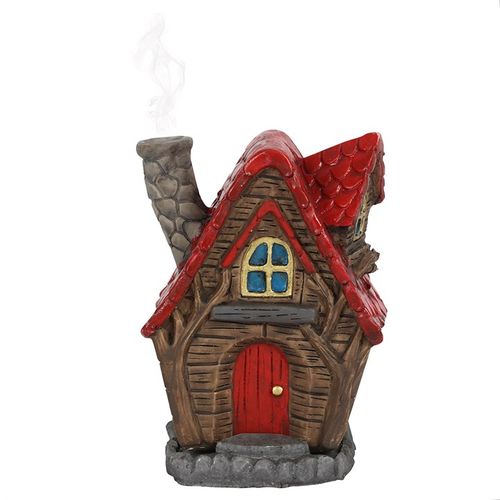 This charming incense cone burner takes the form of a quaint little house. Light an incense cone inside and see delicate smoke curl up through the tiny fairy chimney. Crafted by the enchanting Lisa Parker, it measures 12cm tall, 10cm wide, and 7cm deep. Perfect for adding a touch of magic to your sacred space. Packaged size: 16cm x 12cm x 11cm.
