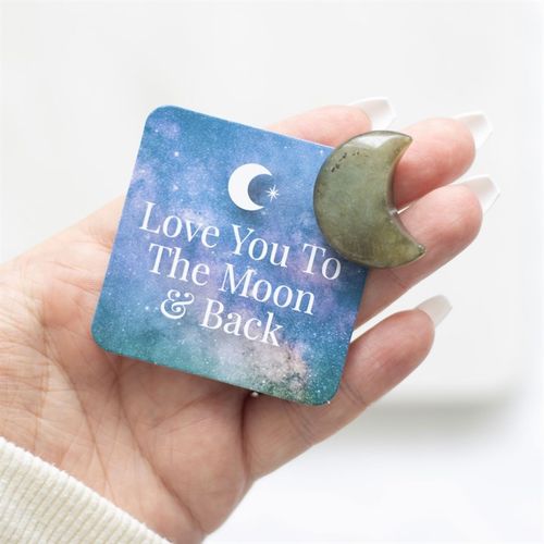 Capture the energy of the moon with this small crescent-shaped labradorite crystal. Accompanied by a matching sentiment card with inspiring, "Love you to the moon & back" text and a drawstring bag, it's the perfect token to remind someone of their inner strength and importance.