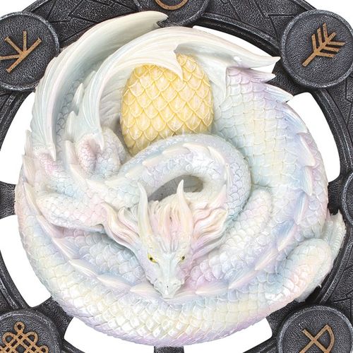 Infuse your space with the enchanting magic of springtime with our stunning resin wall art plaque, showcasing a striking 3D rendition of 'Ostara' dragon artwork by acclaimed fantasy artist Anne Stokes. This mesmerizing piece features a beautiful white dragon set against a circle of sabbat symbols. At the top of the wheel, the symbol of Ostara - representing the Spring Equinox - is displayed, marking a time of new beginnings and fresh starts. This serpent-like dragon tightly coiled around its egg perfectly c