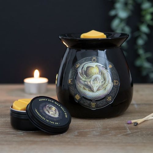 This enchanting gift set includes a beautifully crafted oil burner adorned with the 'Ostara' dragon motif, rendered in vivid, high-quality color. Infused with the warm scent of honey, the wax melts evoke a magical atmosphere. Part of Anne Stokes' 'Dragons of the Sabbat' series, this mystical piece measures 11.5cm tall and 10cm wide and deep, making it a perfect addition to any witch’s sacred space. Packaged thoughtfully at 14.5cm by 11cm by 11cm, it’s ready to inspire and enchant.