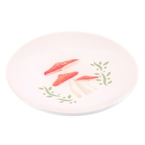 This charming trinket dish showcases an enchanting drawing of three red-spotted mushrooms. Ideal for cradling your jewelry, keys, or little keepsakes gathered from woodland adventures, it adds a magical touch to any cottage or whimsical bedside setting.