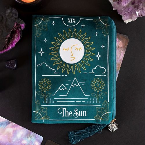 Teal pouch with sun design and 'The Sun' text on a dark background with crystals.