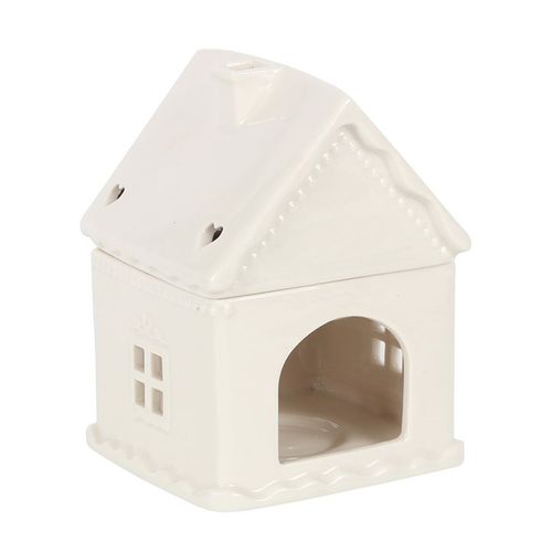Invite warmth and enchantment into your sacred space this Yule season with our White Gingerbread House Oil Burner. Crafted in the shape of a charming, snow-kissed cottage, this sweet ceramic burner channels the nostalgic spirit of winter, invoking cosy candlelit nights and aromatic blessings.
Let this burner be your seasonal altar companion—simply add your favourite festive fragrance oil diluted with water, and watch the gentle flicker of the tealight awaken joy, peace, and clarity in your home.
The lidde