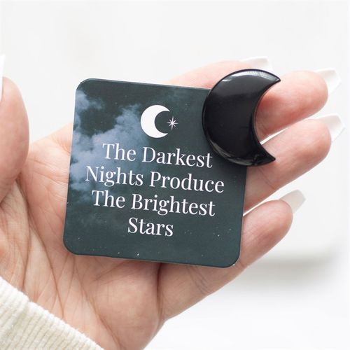 Capture the energy of the moon with this small crescent-shaped black obsidian crystal. Accompanied by a matching sentiment card with inspiring, "The darkest nights produce the brightest stars" text and a drawstring bag, it's the perfect token to remind someone of their inner strength and importance.