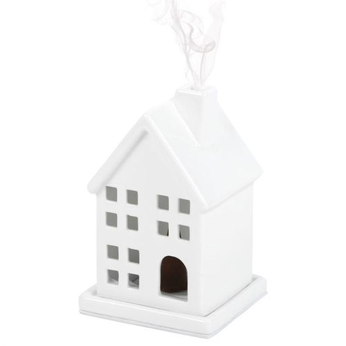 Experience a mystical ambiance with this ceramic incense cone holder crafted in the shape of a quaint house. Its elegant, understated design brings a touch of enchantment to any side table or nightstand, filling your space with captivating aromas that stir the soul.