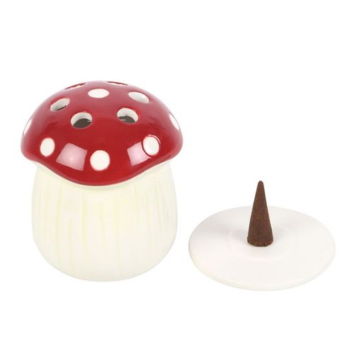 Mushroom-shaped incense burner with a red cap and white body on a white background