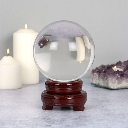 A crystal ball is traditionally used for fortune telling and divination, particularly a practice called scrying, where individuals focus on a reflective surface like a crystal ball to see visions of the future. Some believe crystal balls can facilitate a connection to the divine or reveal hidden information, though their use is often viewed as a tool for intuition and inspiration rather than a literal predictor of the future.