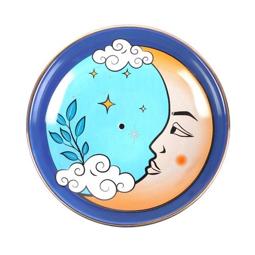 Decorative plate with moon, stars, and clouds design on a white background
