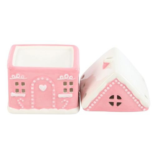 Invite enchantment into your sacred space with this whimsical Candy Pink Gingerbread House Oil Burner, lovingly detailed with frosted snow accents that radiate festive cheer. As a crystal healer, I see this piece not only as décor but as a heartwarming tool to raise the vibration of your home. Light a tealight within, and watch as soft golden light flickers through the windows—creating a nurturing glow that cleanses energy and invites joy.
Perfect for pairing with seasonal fragrance oils (always diluted wi