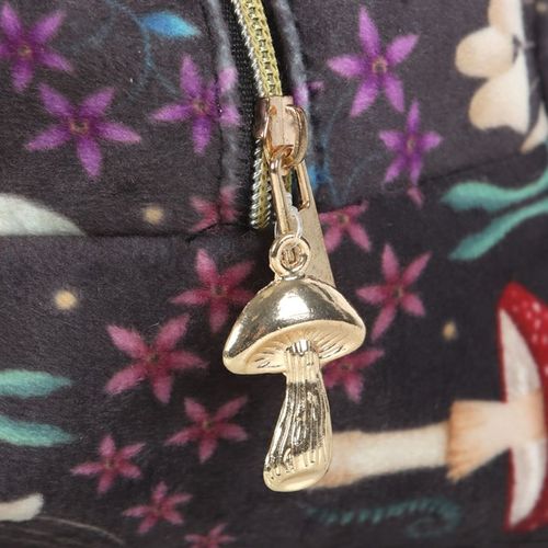 This enchanting zippered bag is ideal for storing toiletries and features a gold tone bee accent and matching tassel. Mystical mushrooms, a glowing luna moth and magickal plants are accented by a gold zip and tassel. The stylish bag is ideal for the home bathroom and perfect for travel.