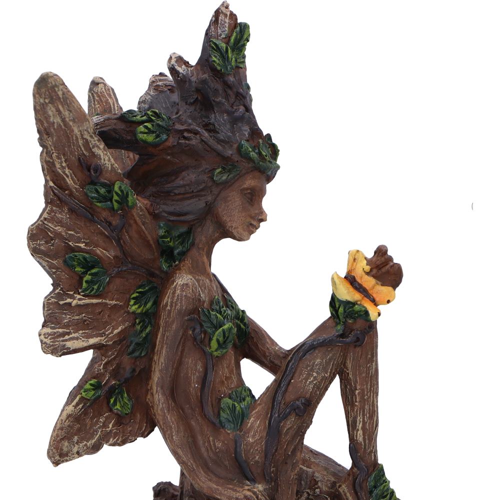 Statue of a nature-themed figure with leaves and branches on a white background