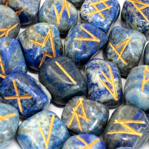 Unlock the secrets of divination with this stunning Lapis Lazuli Rune Set, handcrafted and engraved with the Elder Futhark alphabet. Each set includes 25 runes: 24 featuring sacred symbols and one blank rune for fate and the unknown. Carried in a soft pouch for safe keeping, these runes are ideal for spiritual readings, meditation, or daily guidance rituals.

Lapis Lazuli, known as the Stone of Wisdom and Truth, enhances mental clarity, deepens intuition, and stimulates spiritual insight. It's especially po
