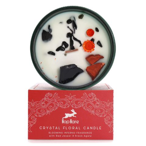 Enter the realm of enchantment with the Hop Hare Crystal Magic Flower Candle - The Devil, infused with Red Jasper, Black Agate, and delicate dried flowers. Accompanied by a tarot card, this candle reveals a spellbinding tale within the fiery essence of Blooming Inferno. Experience the transformative power and botanical charm as the scent unfolds: bright bergamot and lemongrass, floral ylang-ylang and neroli, grounded by patchouli, sandalwood, and vanilla. With a burn time of 22 hours, each candle invites yo