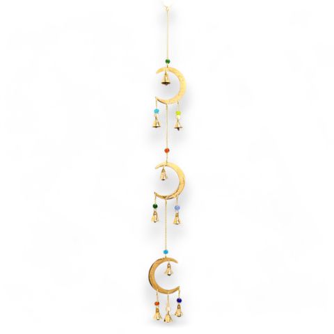 Infused with celestial energy and lovingly handcrafted in the sacred lands of India, the Moon Drop Celestial Wind Chime is a divine addition to any spiritual sanctuary. This 63 cm magical piece features three radiant brass crescent moons, each lovingly adorned with colourful, high-vibration beads that shimmer like protective amulets under sunlight.

Ten gentle brass bells hang below, creating soft, angelic tones that cleanse negative energy and elevate your vibration. The sound is more than just music—it’s 