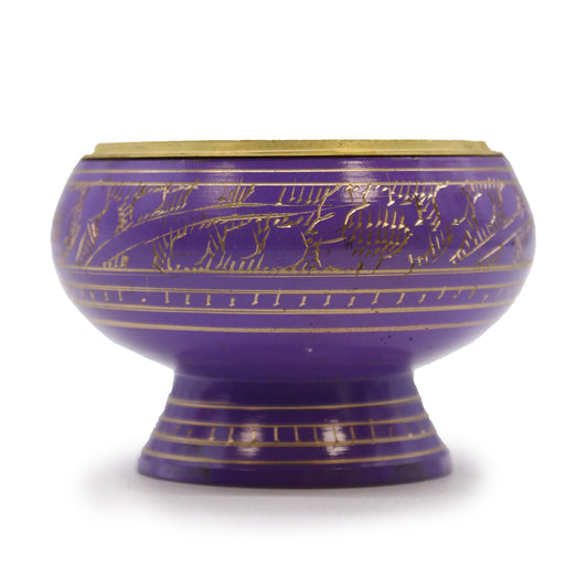 This Charcoal Incense Jar is a beautifully handcrafted piece from India, finished in deep purple and adorned with intricate golden patterns. Its slightly raised base and traditional design make it perfect for ritual use, purification ceremonies, or for working with the Crown chakra.