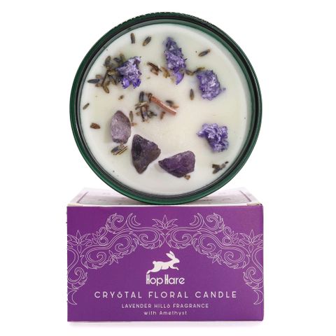 Enter a realm of enchantment with the Hop Hare Crystal Magic Flower Candle - The Moon, infused with Amethyst and delicate lavender blooms. Accompanied by a tarot card revealing a mystical tale, this candle invites you to experience the soothing essence of Lavender Hills. Let the blend of basil, lavender, nutmeg, amber, and patchouli guide your journey of transformation and botanical wonder. With a burn time of 22 hours, each candle holds a unique story, shared on its box, to deepen your magical ritual.