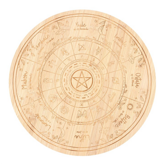Celebrate the turning of the seasons with the Wheel of the Year Serving Board. Crafted from wood and engraved with the sacred symbols of all eight sabbats, this board brings a seasonal touch to gatherings, ritual feasts, or everyday meals. A practical yet spiritual accent, it carries the essence of the Pagan calendar into your kitchen or altar space. Use it to serve bread, fruits, cheeses, or offerings at sabbat celebrations, and let it become part of your ritual rhythm. Hand wash only. Do not soak.