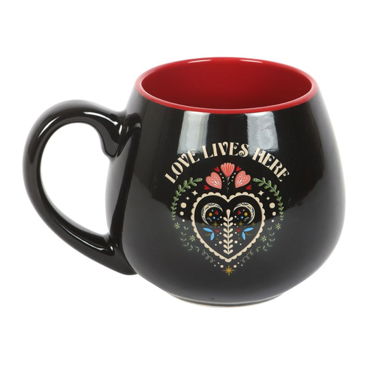 Welcome a touch of hearth magic into your home with the Love Lives Here Folk Heart Rounded Mug, a beautifully shaped ceramic cup crafted for warm brews and even warmer intentions. Finished in deep black with a charming folk-heart motif, this mug carries the gentle reminder that love lingers in every corner where spirit and comfort intertwine.

Its rounded form rests softly in the hands, perfect for witches who savour generous cups of tea, coffee, or moonlit herbal blends. With a spacious 500ml capacity, it 