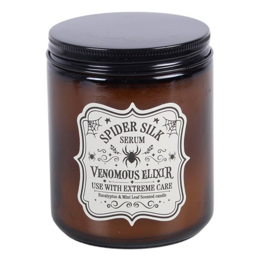 Add a fun and spooky touch to the home with this Spider Silk Serum scented glass candle, featuring a fresh eucalyptus and mint leaf fragrance in a classic apothecary-style jar. Perfect for Halloween displays or for those who enjoy witchy and playful home fragrance, it makes a unique seasonal gift. Approximately 32-hour burn time. Made from paraffin wax. Never leave a lit candle unattended.