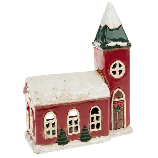 From the Village Pottery collection, this Large Christmas Church tealight holder is a beautiful handcrafted piece that captures the heart of festive tradition. Made from ceramic with rustic detailing, it recreates the charm of a snow-covered church glowing in candlelight. Measuring generously in size, it creates a striking feature in any home when lit with a tealight candle. Perfect for mantelpieces, window displays, or as the centrepiece of a winter village scene, this ceramic tealight holder brings warmth