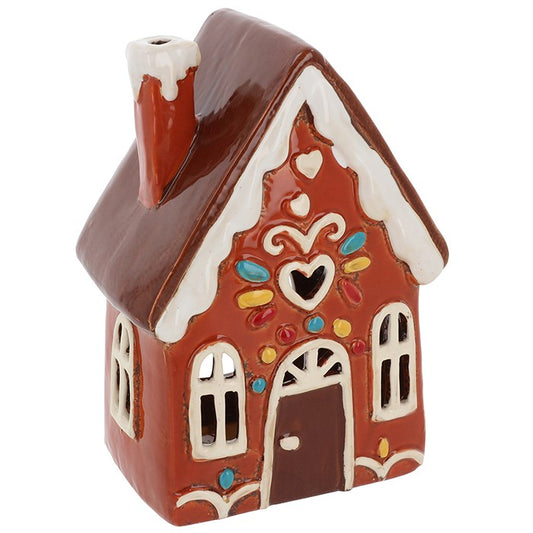 From the hearth of a storybook village comes this handcrafted ceramic gingerbread house, made by the skilled folk of Village Pottery. 🍬🏠✨

With whimsical candy-like detailing and tall fairy-tale charm, each house is lovingly hand-finished, making every piece one-of-a-kind. Nest a tealight inside, and watch as a gentle, golden glow shines through the tiny windows, casting a soft enchantment across your sacred space.

Whether you're celebrating Yule, adding charm to a winter altar, or simply warming your ho