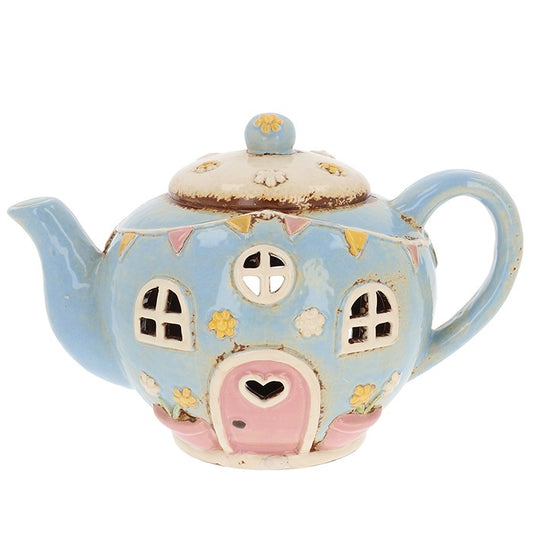 Charming ceramic round teapot tealight holder from Shudehill Village Pottery. Add fairy-tale warmth to your home with this whimsical glowing teapot.