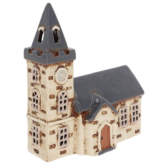 In the heart of a timeless village, the steeple rises towards the sky, bells ready to chime in the still evening air. The Shudehill Village Pottery Steeple Church Tealight Holder (19.5 x 16 x 8.5cm) captures the beauty of this sacred landmark in hand-painted ceramic detail. By day, it is a piece of village charm; by night, with a tealight glowing inside, golden light pours from the windows, casting soft shadows as if echoing whispered hymns and blessings. Perfect for creating a serene, magical ambience in y