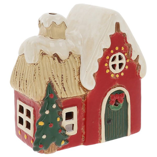 Light up your home with the Village Pottery Round Window House Tealight Holder, a handcrafted ceramic Christmas cottage full of warmth and festive charm.