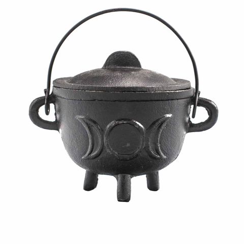 Our Cast Iron Cauldron adorned with the Triple Moon symbol, measuring 11x13cm, is a powerful companion for those seeking to deepen their connection with lunar magic. Emblazoned with the emblem of the Triple Goddess, it guides you through the sacred cycles of life and creation. Crafted from sturdy cast iron, this cauldron endures countless rituals, perfect for burning incense, herbs, and waxes during moonlit ceremonies. Embrace its mystical energy to enhance your spiritual practices. Remember to place it on 