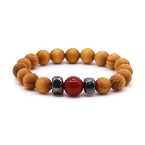 Connect with your inner strength through the Cedarwood Root Chakra Bangle with Red Jasper. This mystical bracelet blends grounding cedarwood beads with the powerful Red Jasper stone, known to boost courage and vitality. It nurtures your Root Chakra, offering stability and a deep sense of security. Perfect for those seeking resilience and spiritual balance, this bangle is a meaningful gift that supports inner peace and empowerment. Diameter: 7cm; Beads: 1cm.
