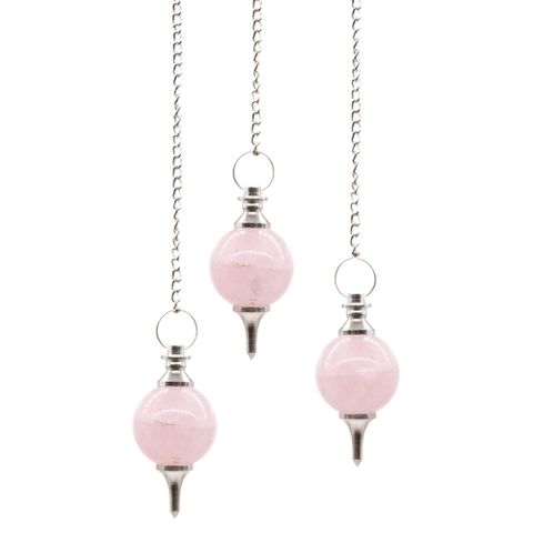 Embrace the sacred energy of the Rose Quartz Sphere Pendulum, a divine tool crafted by the hands of Mother Earth. This pendulum is not just a stone but a beacon of love, healing, and emotional harmony. Each sphere, unique in its natural form, carries the gentle vibrations of compassion, guiding your spirit to open the heart chakra and attract peace.

As you hold this pendulum, its chain — adorned with a gemstone bead — becomes an extension of your intuitive energy, aiding in divination, clarity, and spiritu