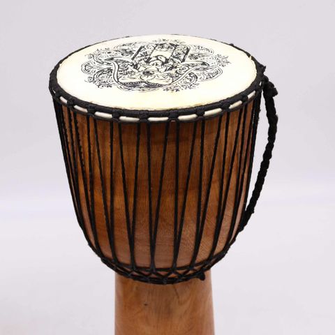 Immerse yourself in rich cultural tradition and powerful sound with our 50cm Wide Top Djembe Drum featuring a beautifully detailed Hamsa design on the skin. Handcrafted to honour the West African drumming legacy, this drum is designed to deliver deep, resonant bass tones thanks to its wider top and larger body.

The Hamsa—also known as the Hand of Fatima or Hand of Miriam—is a spiritual symbol recognised for offering protection, warding off the evil eye, and inviting good fortune. This makes the drum not on