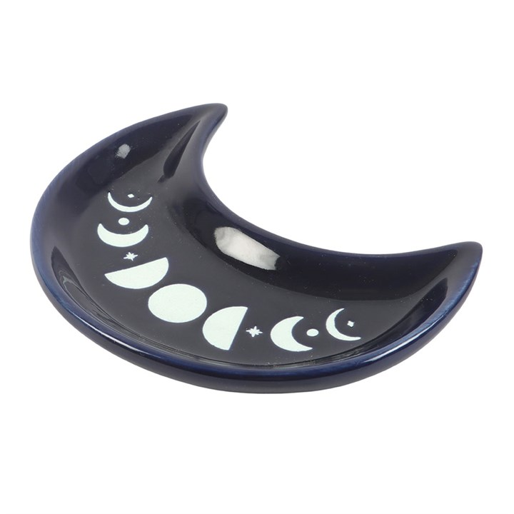 This crescent-shaped trinket dish is finished with a moon phase design, making it ideal for holding rings, crystals or other tiny treasures. A practical and mystical touch for dressing tables or bedside altars.