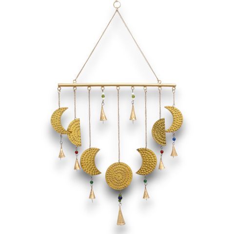 Crafted in India, this enchanting brass chime depicts the moon’s phases with exquisite detail, bringing a mystical aura to any room. Measuring 43x40 cm, it beautifully captures each lunar stage, embodying the eternal cycle of life and rebirth. Delicate brass bells add a gentle, melodic whisper that dances with the breeze, inviting calm and spiritual harmony into your space.

Let this moon phase chime become a sacred addition to your spiritual sanctuary. Each brass crescent and full moon holds the energy of 