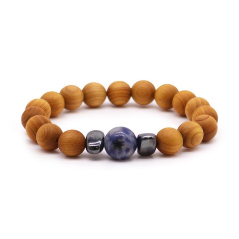 Embrace clear communication and intuition with the Cedarwood Throat Chakra Bangle featuring Sodalite. This enchanting bracelet combines soothing cedarwood aroma and the calming energy of sodalite to support self-expression and spiritual clarity. Perfect for those seeking to speak their truth and deepen their intuitive gifts, it’s a mystical treasure for your holistic collection. Bracelet diameter: 7cm; bead diameter: 1cm.