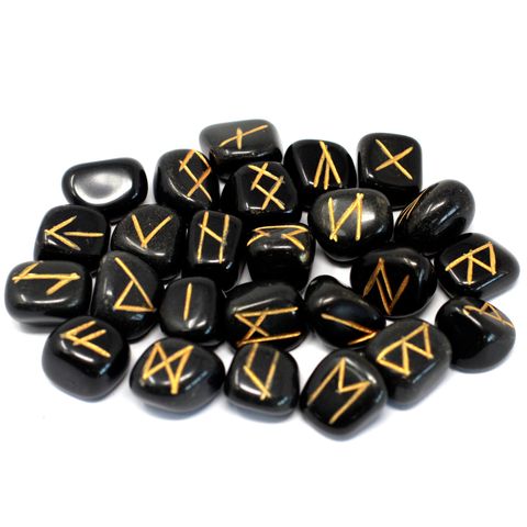 Tap into ancient wisdom with this Black Agate Rune Stone Set, beautifully hand-carved and polished in India. Each set includes 25 stones—24 engraved with traditional Elder Futhark runes and 1 blank stone, used for fate or the unknown. These runes are housed in a soft drawstring pouch for safekeeping.

Black Agate is a powerful grounding stone, known for offering protection, emotional balance, and inner strength. It helps ward off negative energies and encourages clarity during readings and spiritual work. W