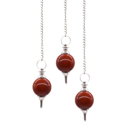 Awaken your spirit and divine the unseen with the sacred Sphere Pendulum crafted from Red Jasper, a stone of grounding and protection. As a shamanic tool, this pendulum channels the earth’s powerful energy, guiding your intuition and balancing your root chakra. Its deep red hues pulse with ancient strength, promoting courage, stability, and vitality. The attached chain, adorned with a gemstone bead, allows your spirit to dance freely between worlds as you seek answers and healing.