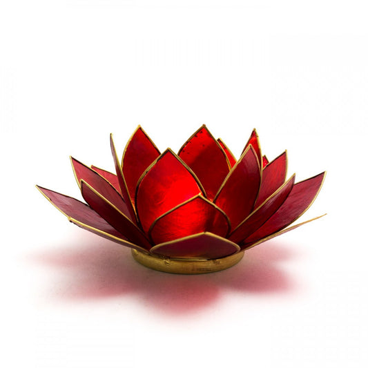 Ground your space with this Red Lotus Candle Holder, a radiant symbol of the root chakra and inner strength. Handcrafted from natural Capiz shell, its deep red petals edged in gold unfold like a sacred bloom, casting a warm, calming glow when lit. Perfect for meditation, altar work, and creating a peaceful atmosphere, this fair trade piece carries both beauty and intention. Designed to hold a tealight or small candle, it invites balance, stability, and a sense of rooted energy into your sacred space.