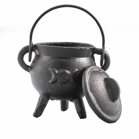 This cast iron cauldron, adorned with the Triple Moon symbol, is a powerful tool for your spiritual rituals. Its sturdy design holds heat well, ideal for burning incense or herbs. Compact at 6x10 cm, it fits perfectly on any altar, enhancing your connection to lunar and feminine energies. Handle with care, as it becomes hot during use. Create a sacred space and deepen your magical practice with this mystical cauldron.
