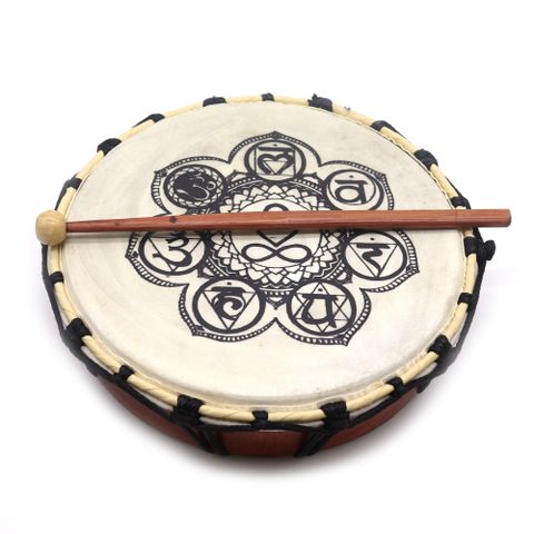 Discover harmony in every beat with the 25cm Chakra Shamanic Drum with Stick – a sacred instrument that balances body, mind, and spirit. Crafted from sustainable Suar wood and authentic goat skin, this drum resonates with rich, earthy tones that transport the soul. Intricate Chakra symbols adorn the surface, inviting spiritual alignment and holistic healing.

Whether used in rituals, meditation, sound therapy, or as a spiritual décor piece, this drum makes a powerful addition to any sacred space.

Features: