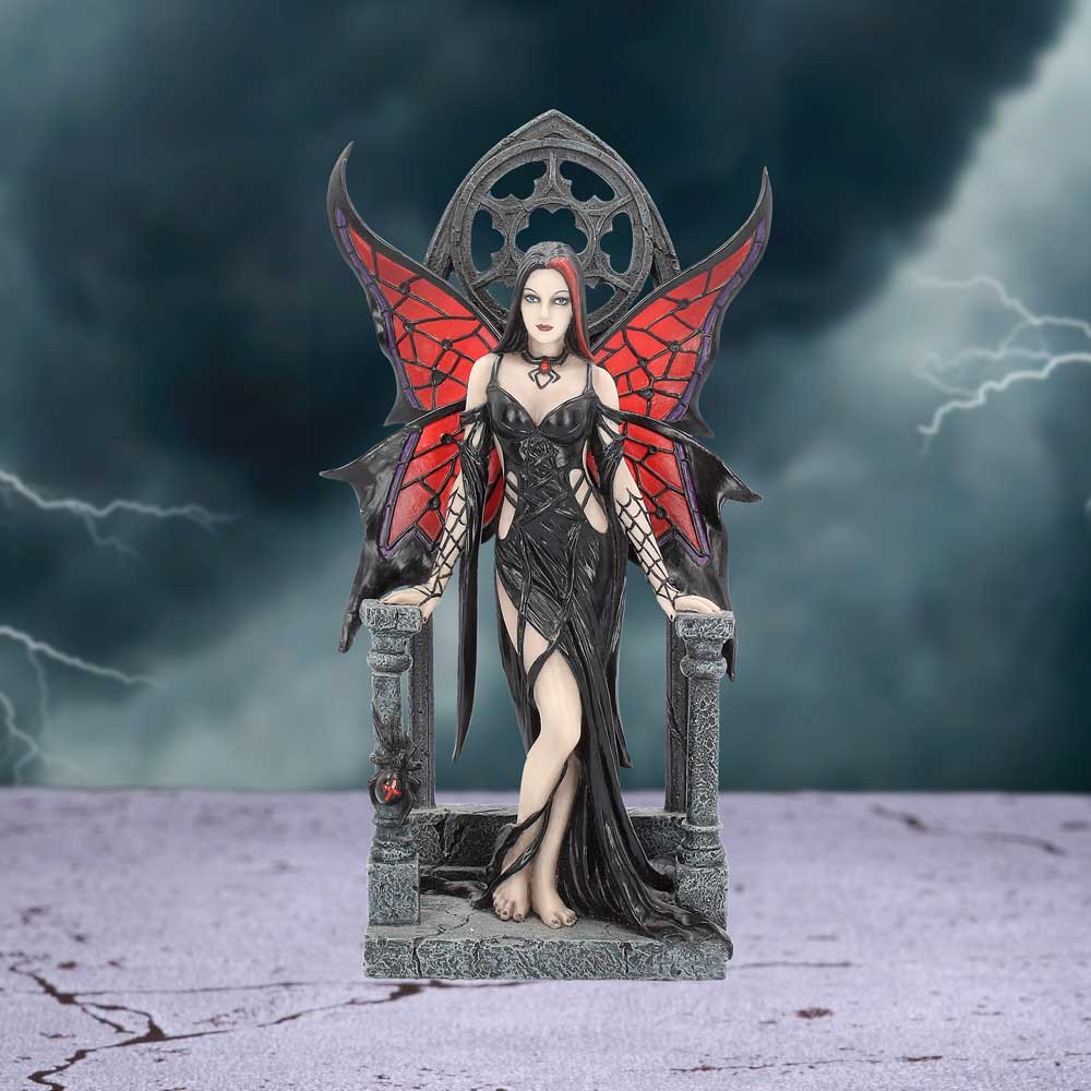 Statue of a fairy with red wings and a dark dress against a stormy background